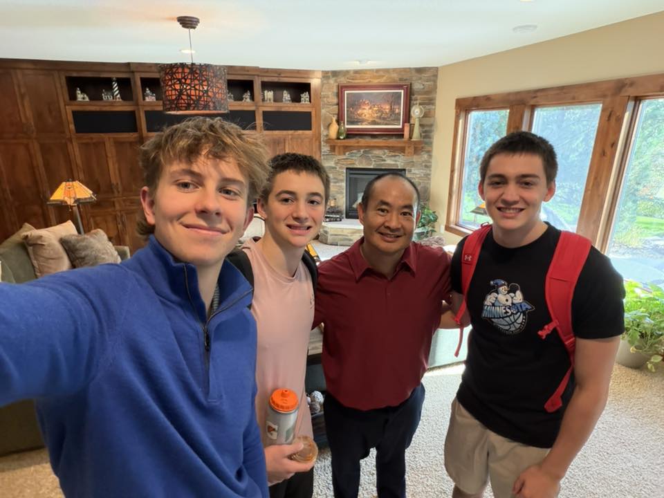 Jack Wendt and Dennis Yu with the team at Jack's house in Minnesota
