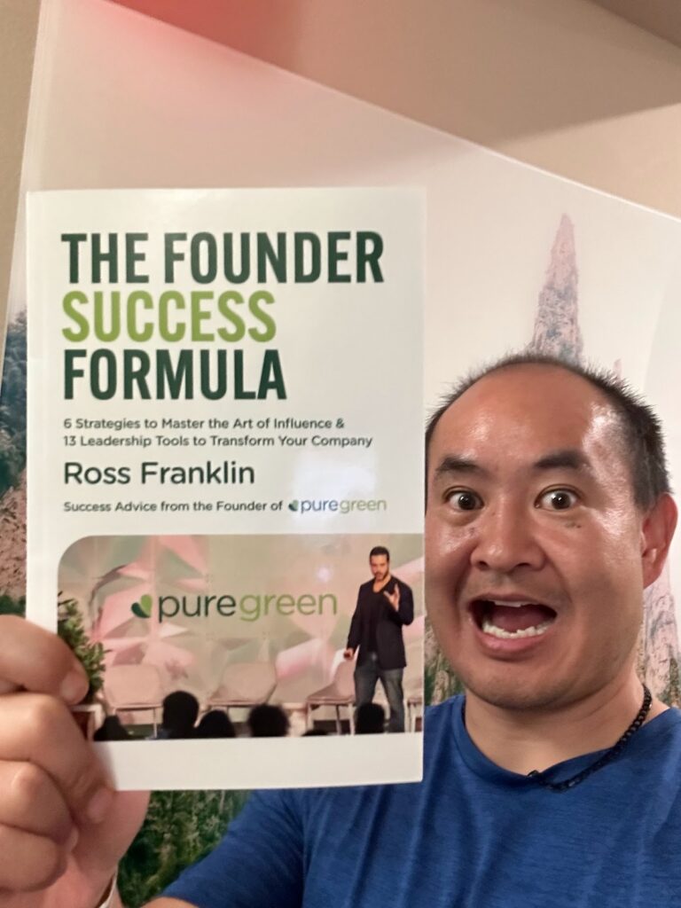 Dennis Yu holding Ross Franklin’s book The Founder Success Formula — July 2023